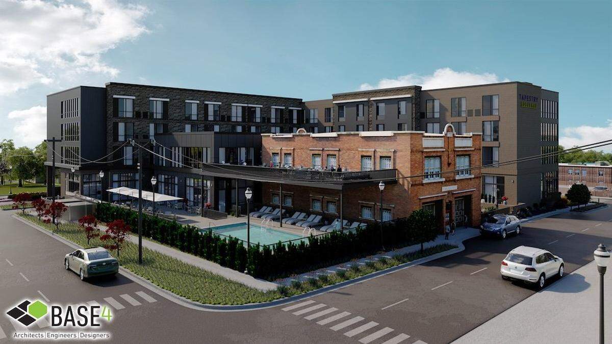 A conceptual photo showing the Nobleman Hotel being built around fire station 5 on Bryan Avenue.