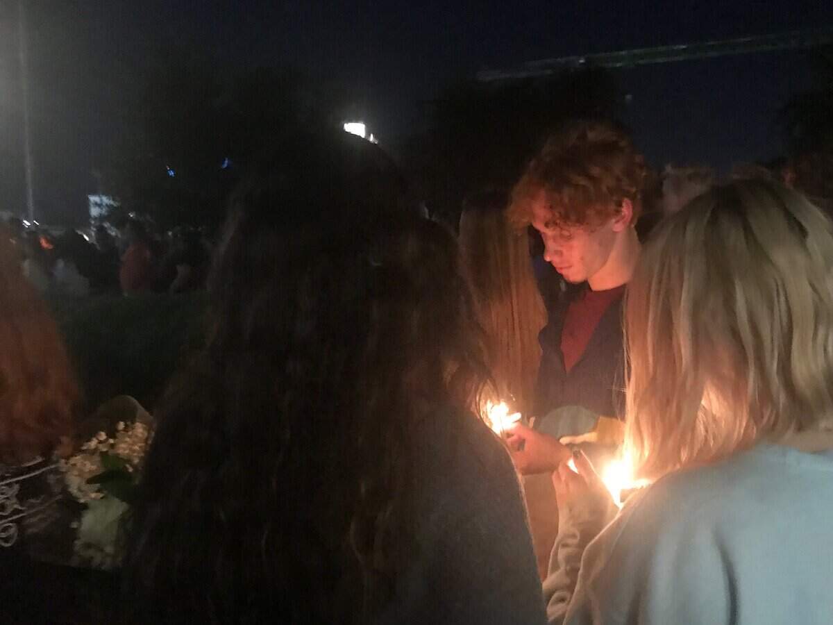 Pascnal High School students hold a vigil Wednesday night for junior Nick Delgadillo, 17, who died Tuesday in a car accident near the school.
