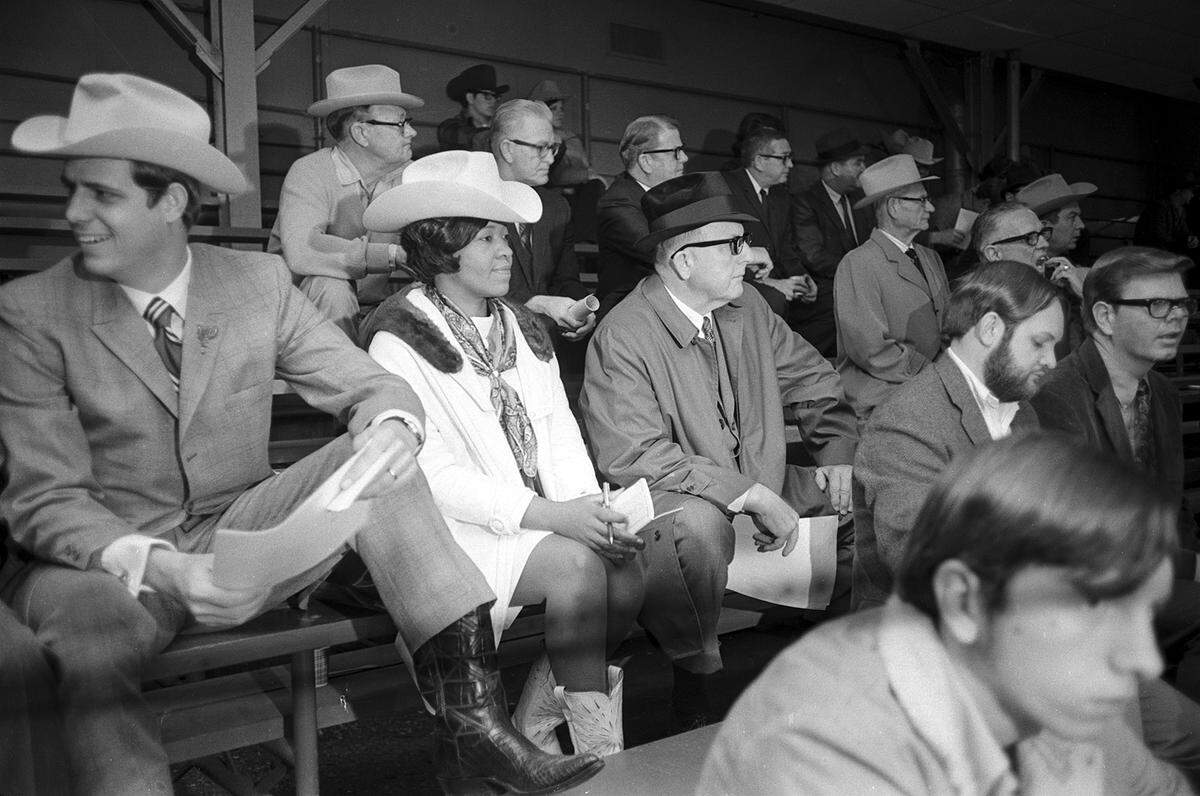 Beatrice Pringle, representing Good Publishing Co. of Fort Worth, sits among a crowd before placing the winning bid of $7,000 for the grand champion steer of the 1970 Fort Worth Fat Stock Show.