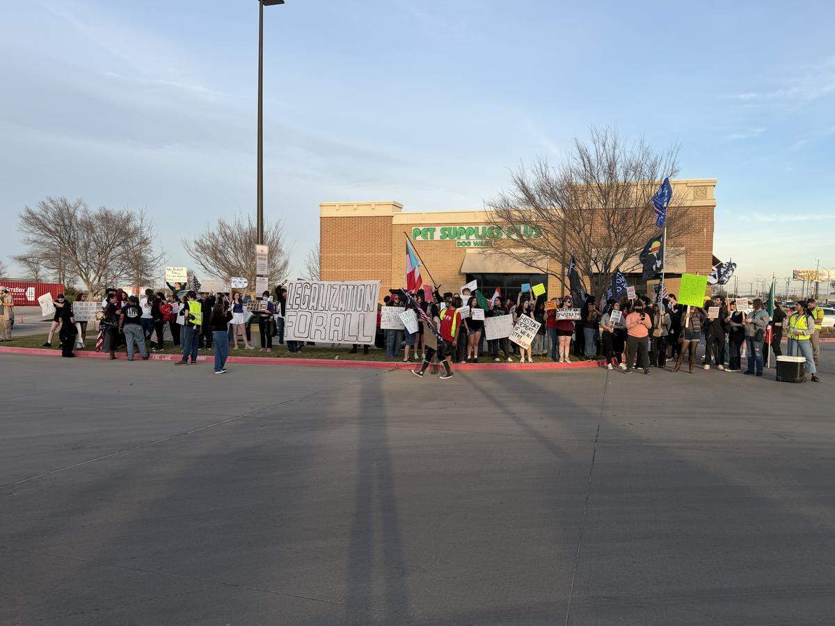 Students at Boswell High School marched to a Kroger on Bailey Boswell Road Monday evening during the anti-ICE protest.