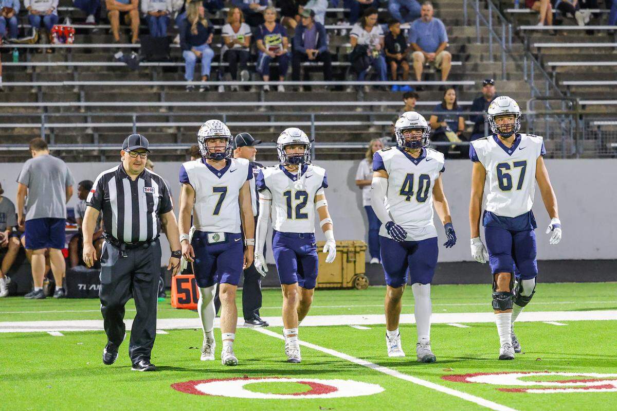 Keller’s captains take the field for the coin flip at Northwest ISD Stadium in Justin, Texas, Friday, Nov. 7, 2025.