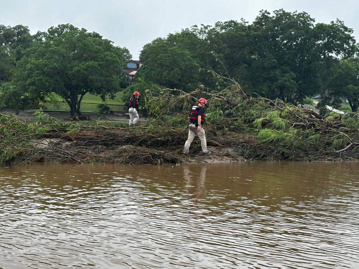 July 7, 2025; Guadalupe River, TX, USA; TEXSAR search-and-rescue volunteers scour the banks of the Guadalupe River, looking for victims of the recent floods. The group has deployed 50 volunteers and six swift-water rescue boats to help search for victims. Mandatory Credit: Courtesy of TEXSAR via Imagn Images