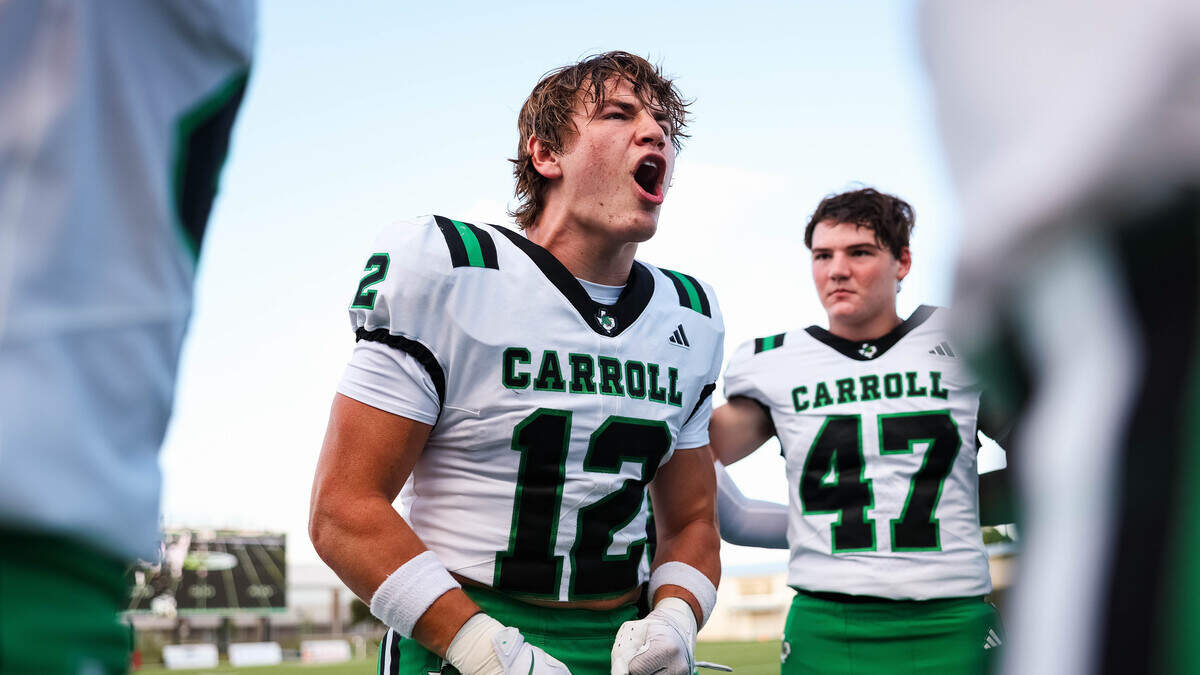 Southlake Carroll linebacker Marcus Brouse yells to his position group in a pregame huddle before a district matchup against Timber Creek on Sept. 25 at Keller ISD Stadium.