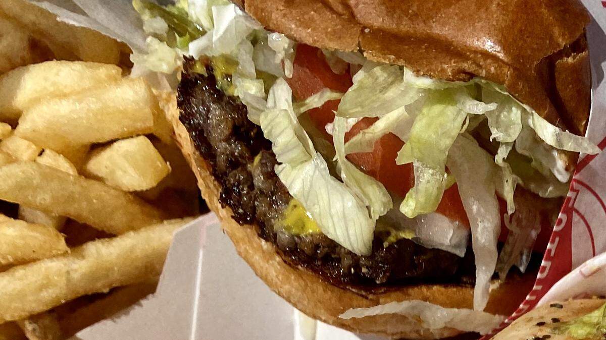 A Fatburger with the browned, crisp edge from the griddle.
