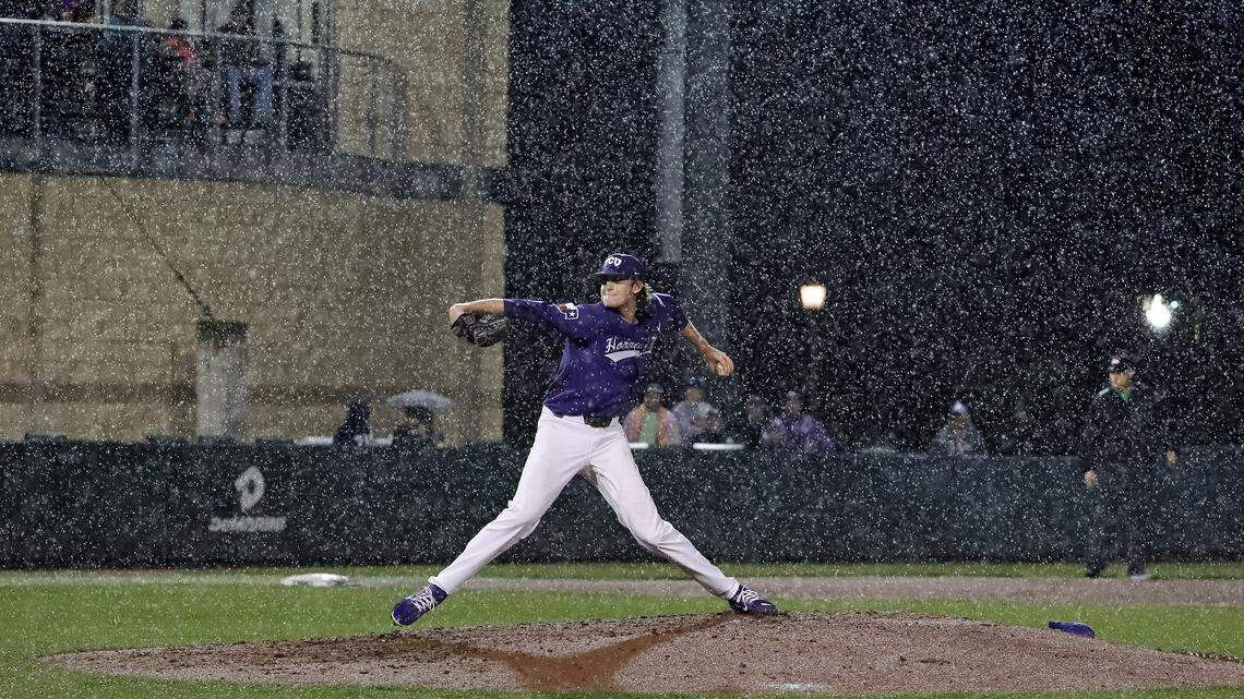TCU starting pitcher Nick Lodolo delivers in the pouring rain, the last pitch before the game was suspended in the top of the third inning.