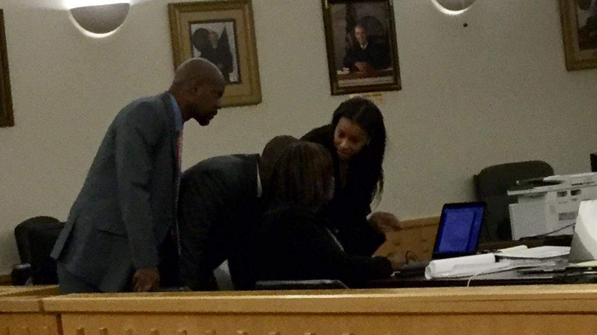 Steven Ashley, left, looks over his attorneys’ shoulders Tuesday during his sexual assault trial.
