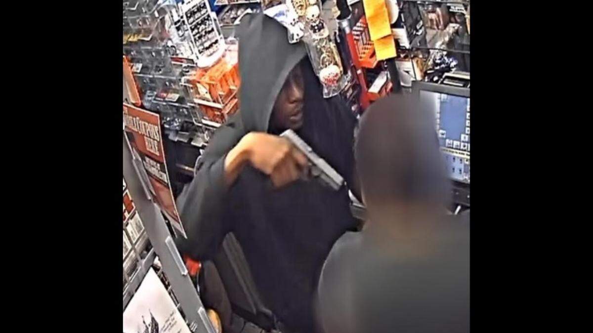 This is a surveillance photo of a suspect in the Saturday night killing of a store clerk in Garland.