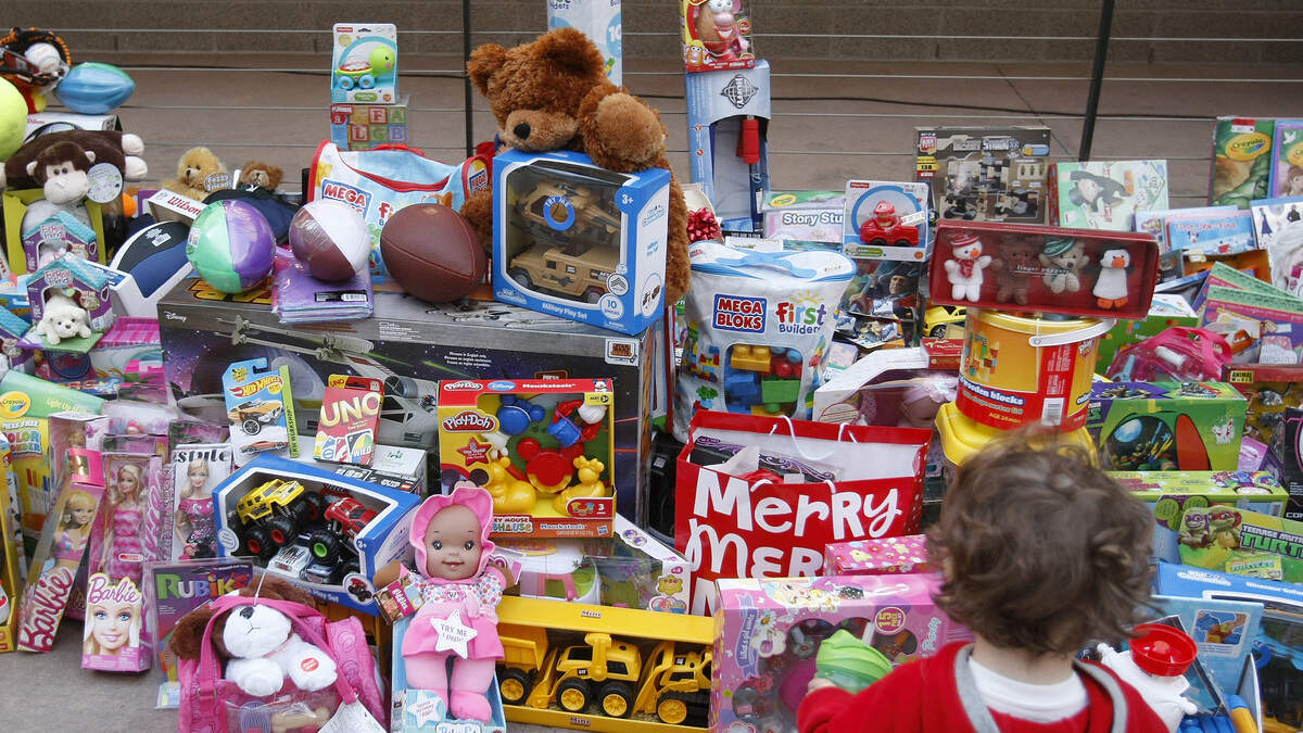 Donated toys accumulate at the Cowboy Santas toy drive at Globe Life Ballpark in Arlington on Tuesday, December 16, 2014. (Star-Telegram/Khampha Bouaphanh)
