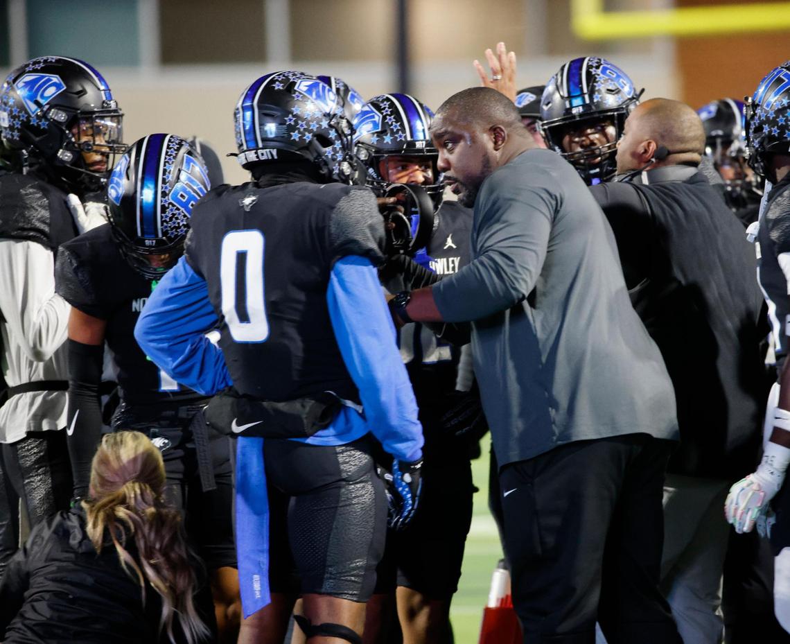 North Crowley head coach Ray Gates talks to linebacker Ja’Brelle Asberry (0) during a time out during a UIL Class 6A D1 Area Round football playoff football game at Crowley ISD Multi-Purpose Stadium in Fort Worth, Texas, Friday, Nov. 22, 2024.
