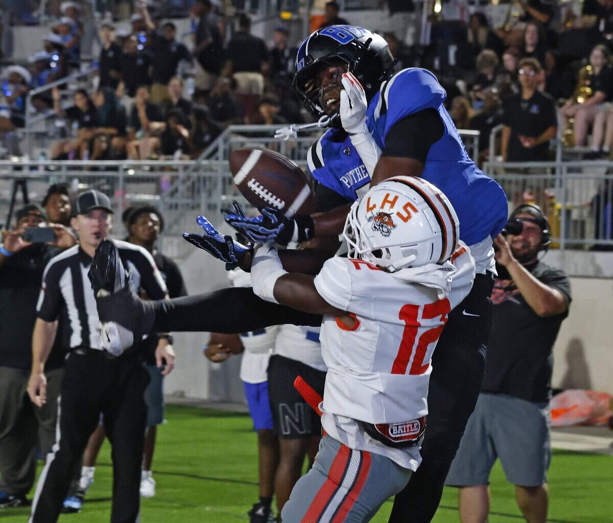 North Crowley wide receiver Damarion Mays (2) grabs a touchdown pass defended by Lancaster defensive back Tristan Nobles (12) during the second half of a UIL football game at Crowley ISD Stadium in Crowley, Texas, Thursday, August 28, 2025.