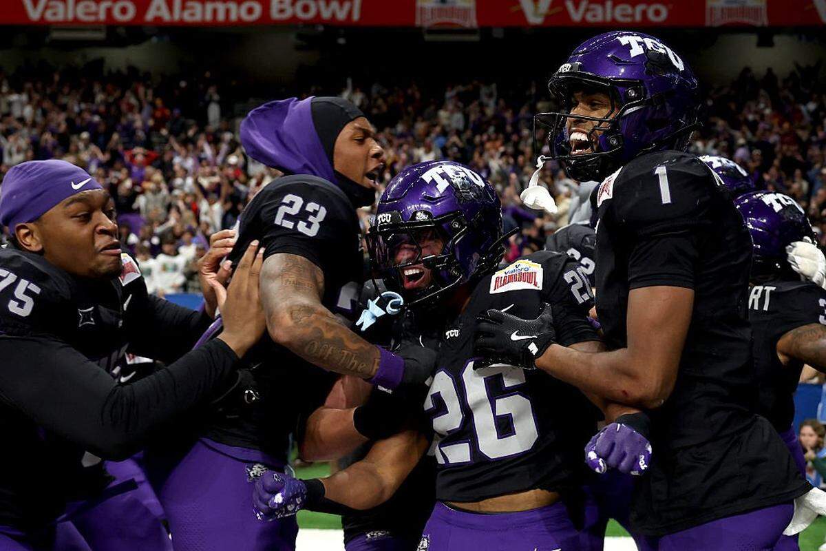 SAN ANTONIO, TEXAS - DECEMBER 30: Jeremy Payne #26 of the TCU Horned Frogs celebrates with teammates after scoring the final touchdown of overtime during the game against the USC Trojansat Alamodome on December 30, 2025 in San Antonio, Texas. (Photo by Kenneth Richmond/Getty Images)