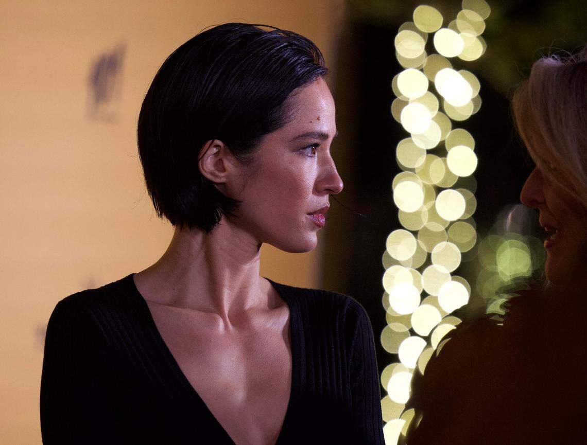 Kelsey Asbille stopped for photos in a long black dress and a new hairstyle. Could this be the mom do?