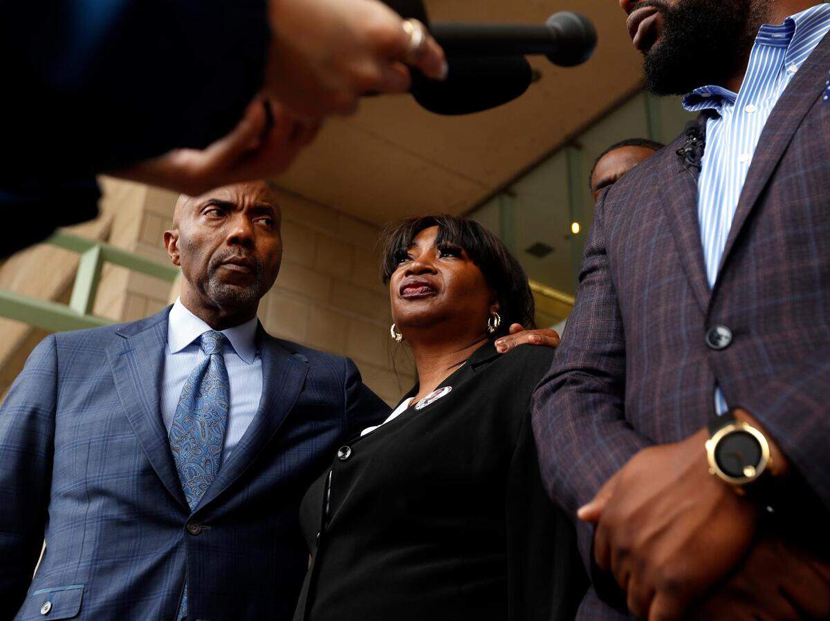 Sherley Woods, mother of O’Shae Terry, stands between attorneys Daryl Washington, left, and Lee Merritt during a press conference on Wednesday, May 1, 2019, to announce the Arlington police officer who shot and killed Terry during a traffic stop in September has been indicted on a charge of criminally negligent homicide.  Officer Bau Tran shot and killed Terry when he tried to drive away from a traffic stop  on Sept. 1.