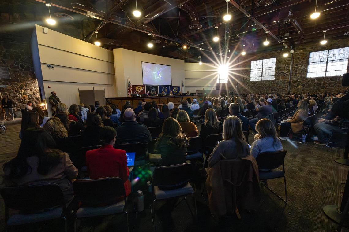 The sun breaks through the window as multiple meeting attendees file in during a special meeting regarding the possible split of the Keller Independent School District at the Keller ISD Education Center in Keller on Thursday, Jan. 16, 2025.