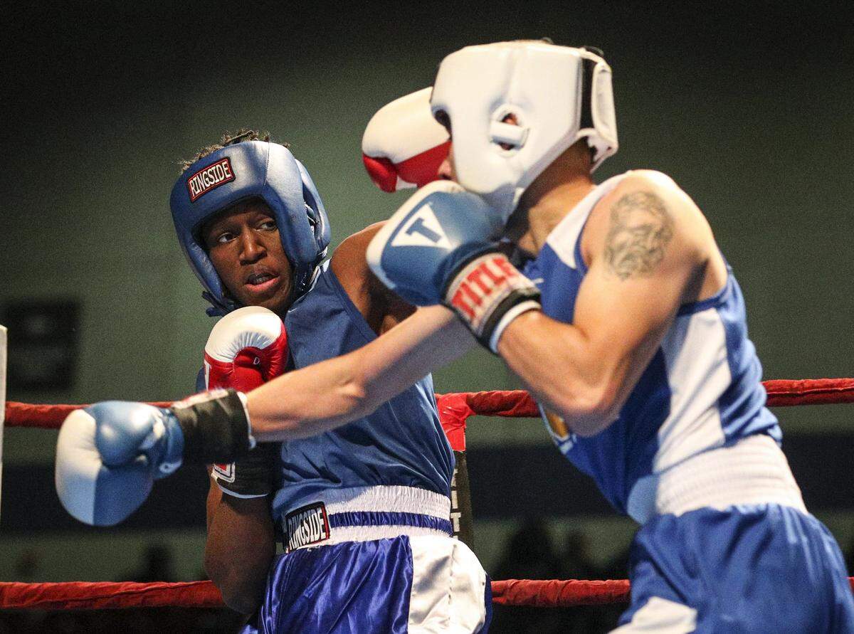 Deacon Bursey, left, battles Ivan Fraire in the Men's Novice 132lb class at Fort Worth Regional Golden Gloves at Wyatt Arena in Fort Worth, Texas, Tuesday, February 20, 2018.