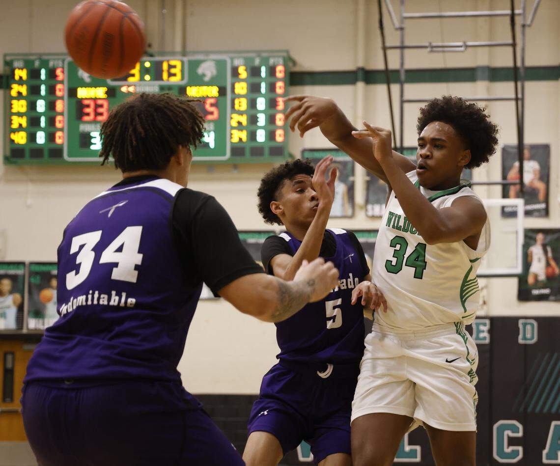 Kennedale guard Carter Shedrick (34) passes across court away from Alvarado guard Brendyn Webb (5) and forward Daylan Ellison (34) during the first half of a UIL boys basketball game between Alvarado and Kennedale at Kennedale High School in Kennedale, Texas, Tuesday Jan. 13, 2026