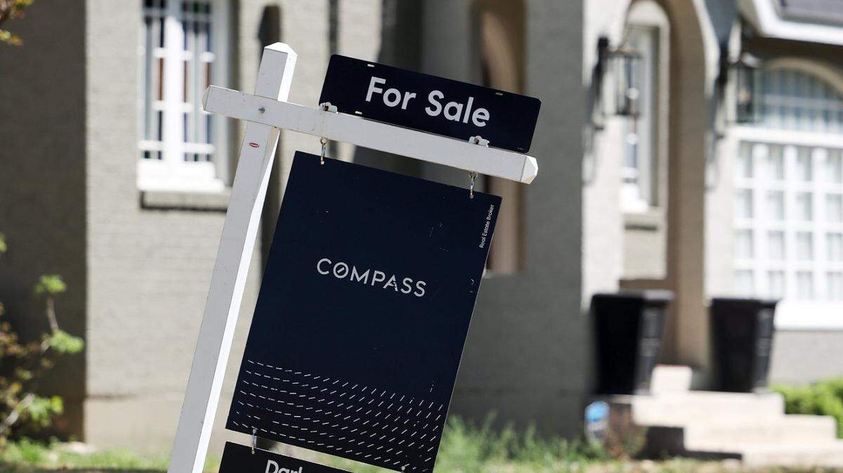 A sign advertises a home for sale in the University Place neighborhood of Fort Worth on Monday, April 3, 2023. The home listing was reduced in price at the end of February.