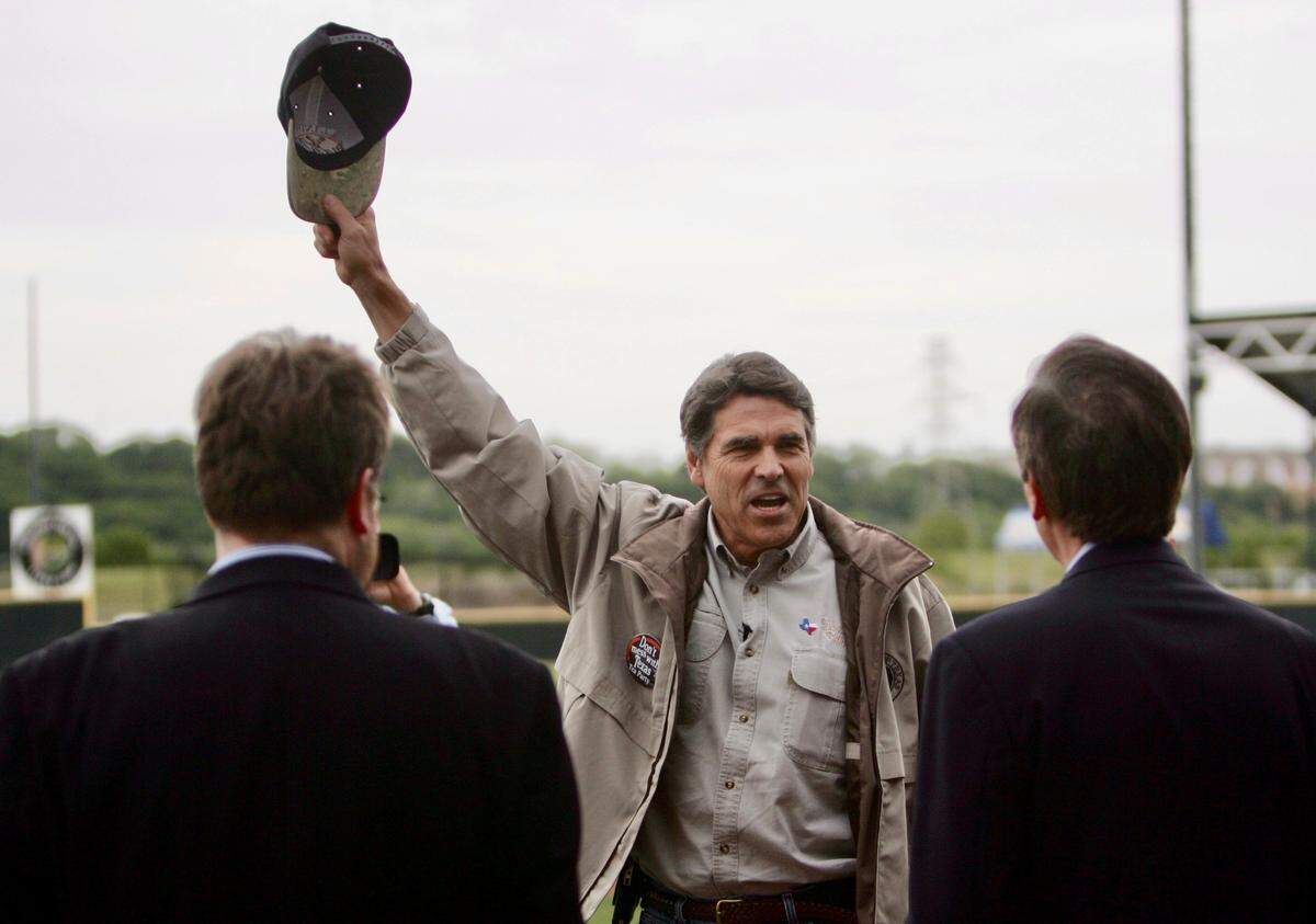 Texas Gov. Rick Perry acknowledges the crowd during a tea party (”Taxed Enough Already”) rally April 15, 2009, at LaGrave Field in Fort Worth.. Organizers used Facebook and Twitter, now X.com. to organize the event on tax deadline day.