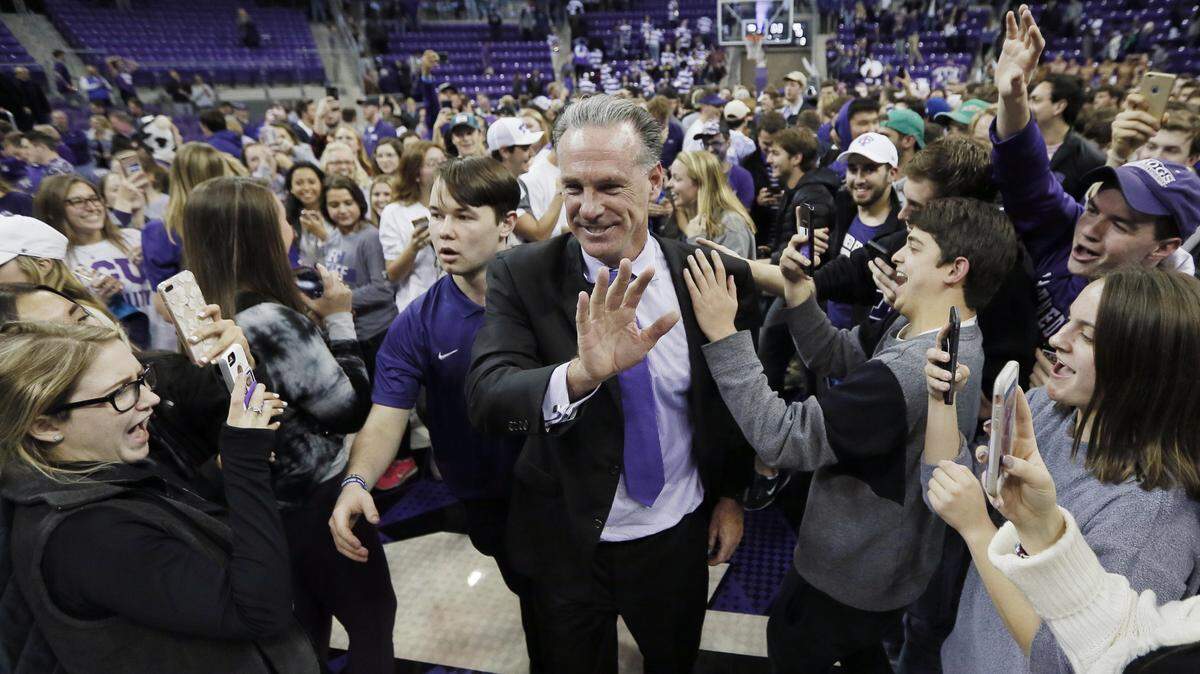 TCU head coach Jamie Dixon is congratulated by fans after the Horned Frogs beat No. 7 West Virginia 82-73 on Jan. 22 at Schollmaier Arena.