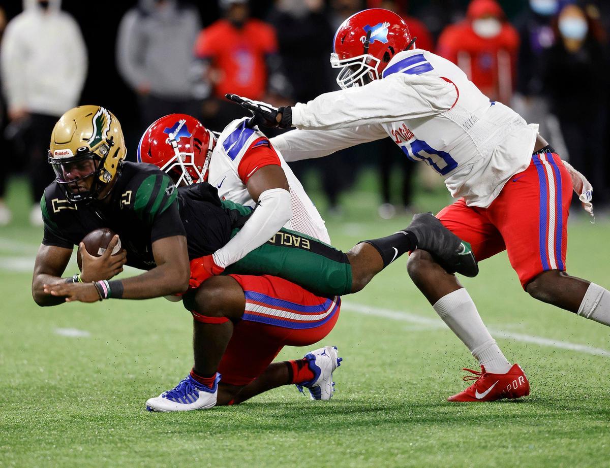 Duncanville defensive lineman Omari Abor (23) sacks DeSoto quarterback Samari Collier (1) for an 11 yard loss during the 6A division 1 quarterfinals at Globe Life Park in Arlington, Texas, Saturday, Jan. 02, 2021. Duncanville led 28-7 at the half. (Special to the Star-Telegram Bob Booth)