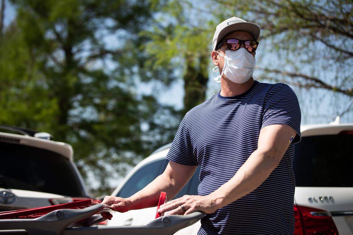 Heath Bowman wears a mask while shopping amid the coronavirus outbreak Friday, April 10, 2020, in Fort Worth.