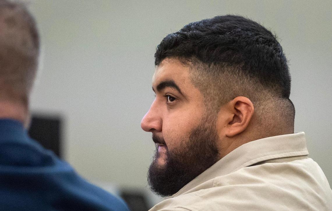 Defendant Peter Cardona sits with his lawyer during trial at the Tim Curry Criminal Justice Center in Fort Worth on Tuesday, Feb. 14, 2023. Cardona is charged with murder in the 2020 shooting of Alfredo Olivares, 19.