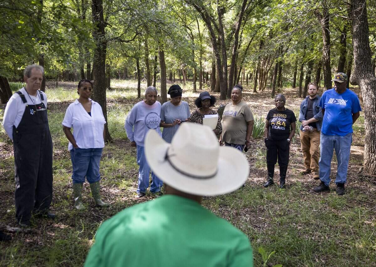 St. John's Cemetery Association gathers at the cemetery, which is the last remaining evidence of the St. John's freedmen settlement community, on Saturday, May 9, 2026, in Pilot Point, Texas. The association hopes to mark the boundaries of the cemetery with a fence and to properly mark the graves of those buried there.