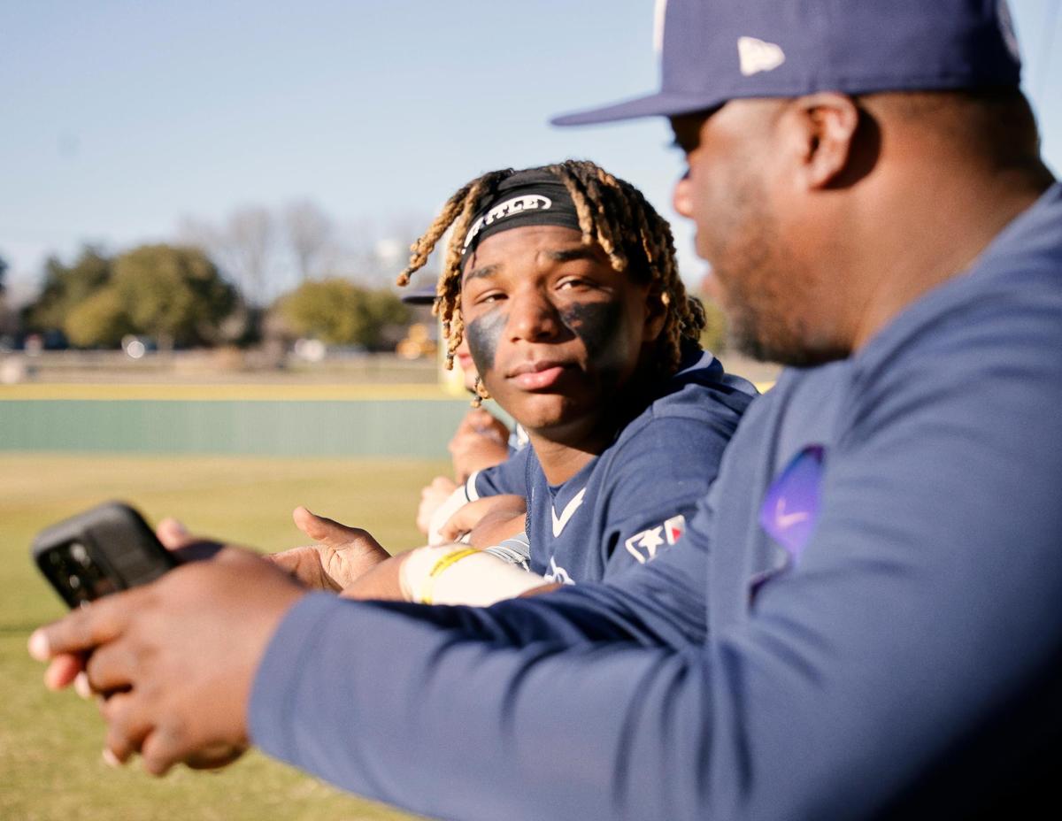 Wyatt catcher Jorvorskie Lane (2) talks with head coach Quinlin D. Germany in the dugout during a UIL baseball game at Benbrook High School in Fort Worth, Texas, Thursday, Feb. 22, 2024.