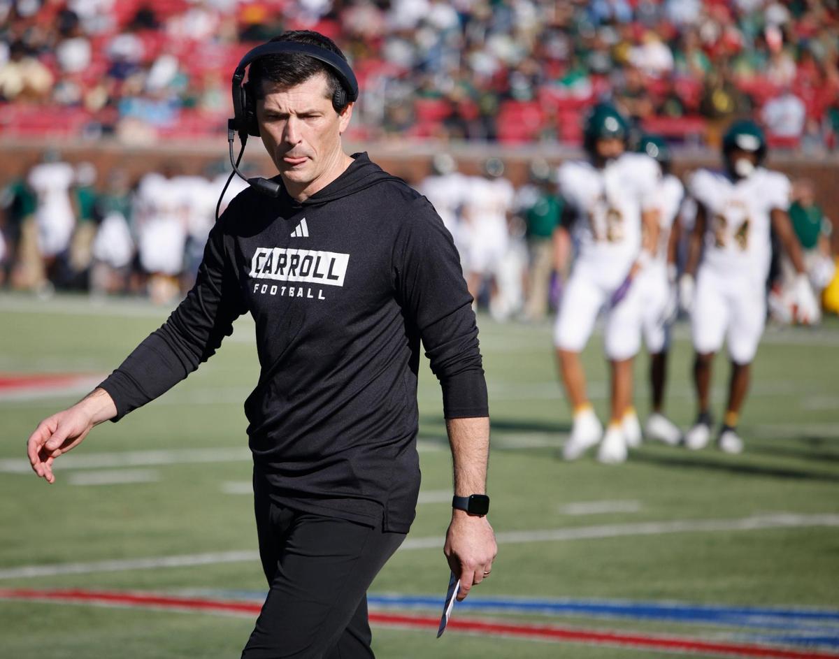 Southlake Carroll head coach Riley Dodge heads to the sidelines after a timeout during the UIL 6A D2 Semifinals football game against Longview at Gerald J. Ford Stadium in University Park, Texas, Saturday, Dec. 14, 2024.