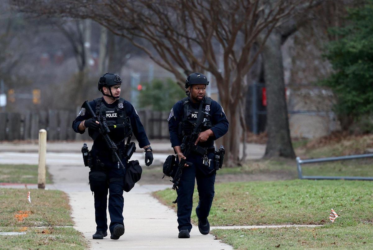 Members of the Fort Worth Police Department return to the front of Ridglea Hills Elementary School after children and adults were released from the building around 5:45 p.m. on Monday, February 13, 2023. An off-campus domestic situation led authorities to place the school on “a secured status” and conduct a “controlled release” of students after dismissal time, according to a Fort Worth ISD spokesperson.