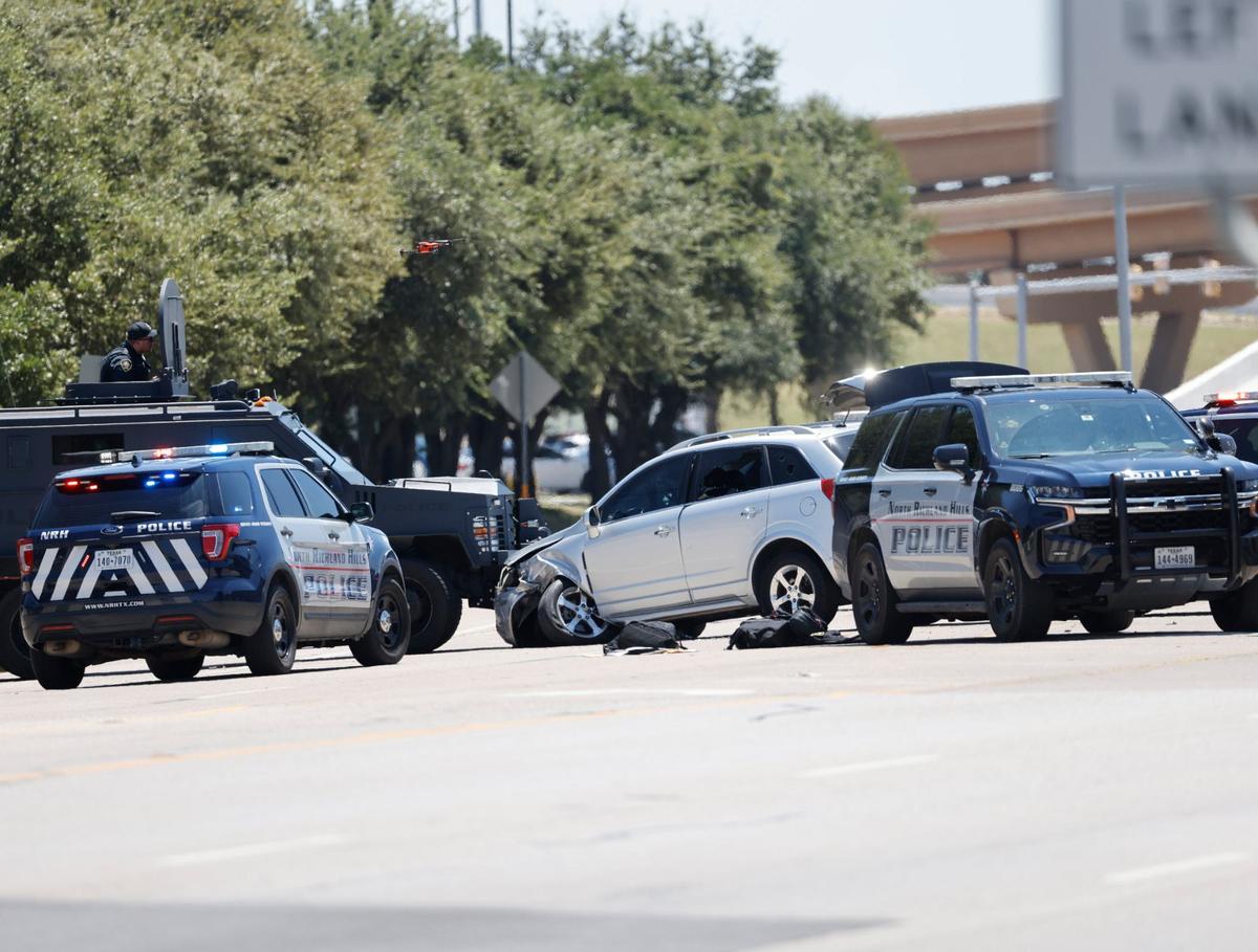 A police standoff in North Richland Hills on Davis Boulevard on Saturday, Aug. 3, 2024, ended when officers fired several rounds of gas through the suspect’s front windshield. The suspect was taken into custody.