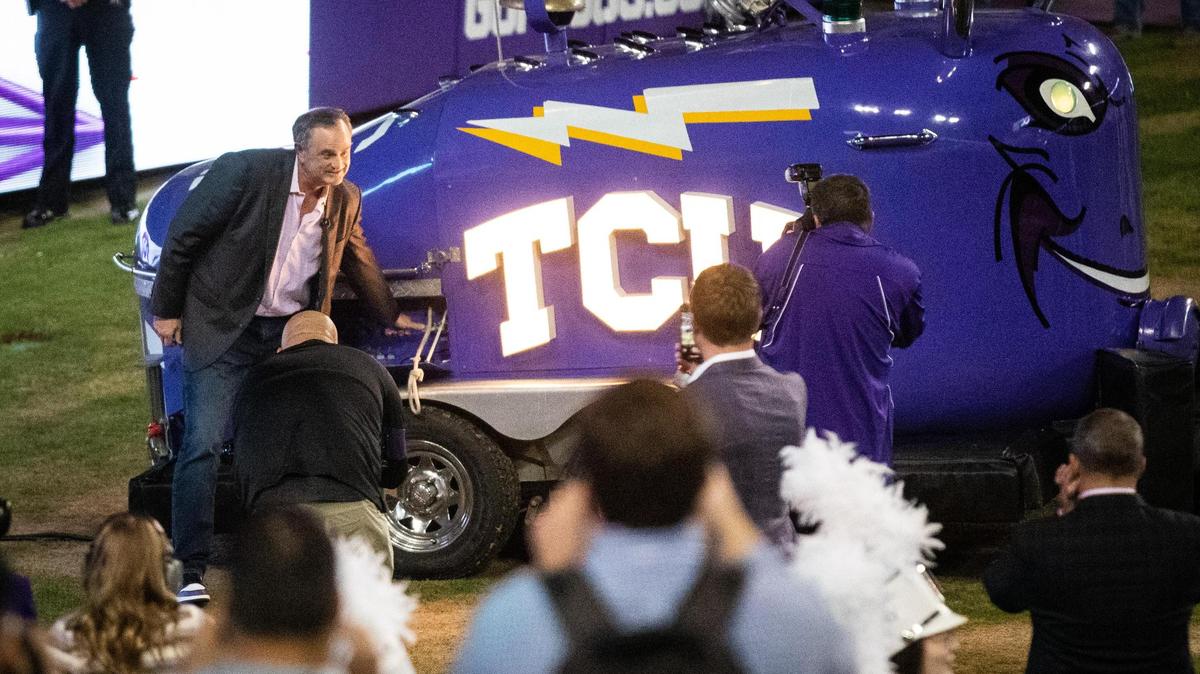 The new TCU football head coach Sonny Dykes rings the horn after arrives by helicopter Monday, Nov. 29, 2021, to Amon G. Carter Stadium.