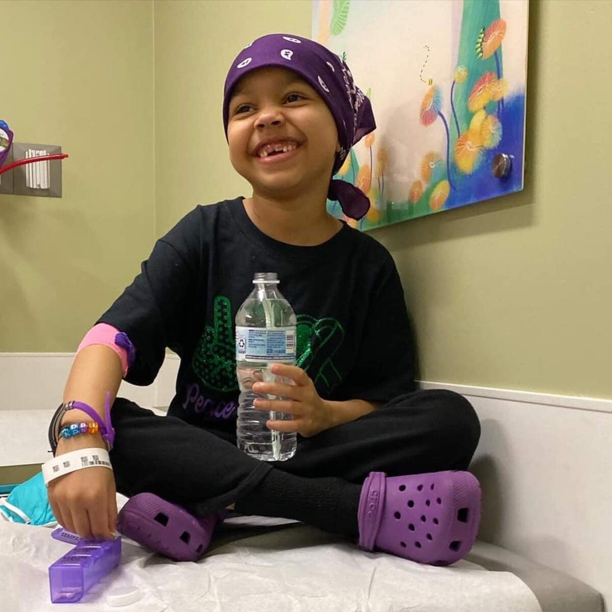 Adriana Nixon, then 7, smiles with a water bottle in this photo provided by her mother, Andrea Pederson.