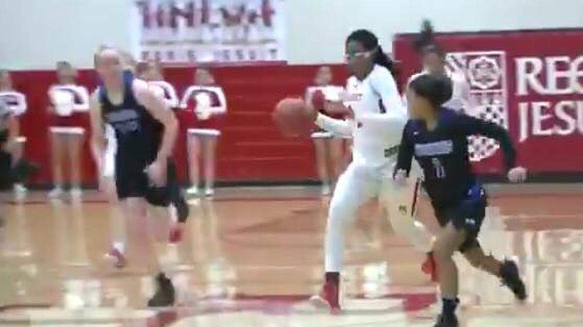 Stanford signee Fran Belibi, with ball, for Regis Jesuit High School in Colorado.