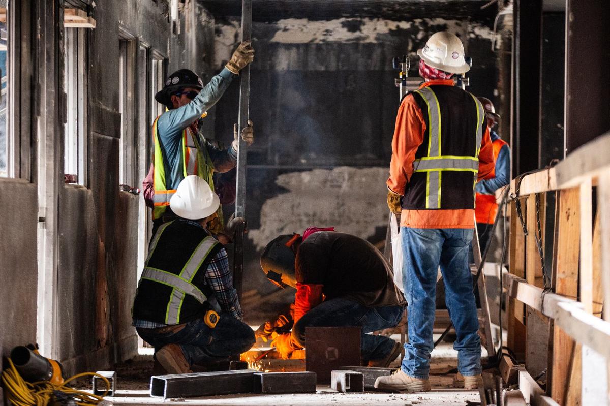 Construction workers weld a support beam on July 17, 2024 at the Fort Worth Public Market. Construction began June 2023 and are expecting to be done by August 2025.