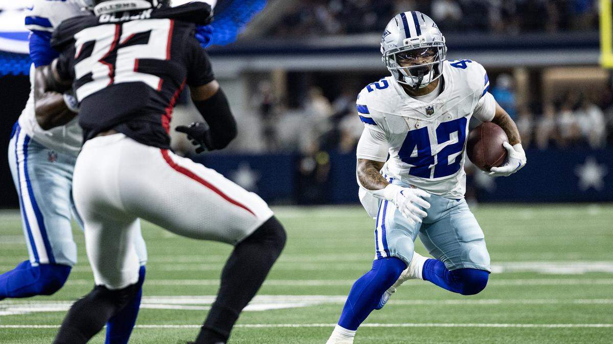 Cowboys running back Deuce Vaughn (42) rushes to the end zone in the first half of an NFL preseason game between the Dallas Cowboys and the Atlanta Falcons at AT&T Stadium in Arlington on Friday, Aug. 22, 2025,