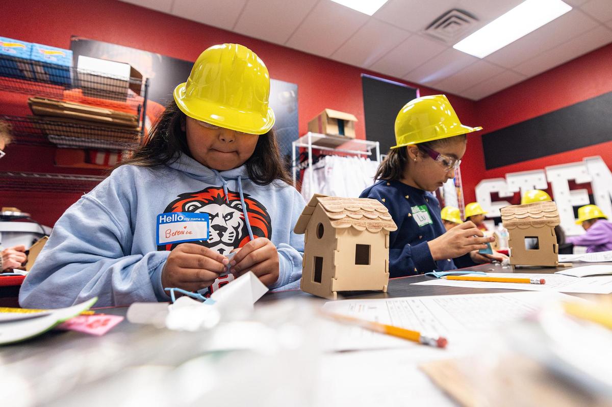Berenice Rodriguez, 9, left, and Luci Tello, 9, build and decorate their model houses during the ‘Women in Construction’ event by Girls Inc. of Tarrant County at their headquarters in Fort Worth on Saturday, March 8, 2025.