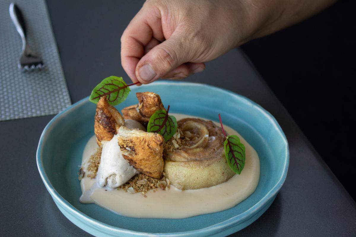Head Chef Mora at Cafe Modern puts the finishing touches on the Apple Jack Pie a la Mode.