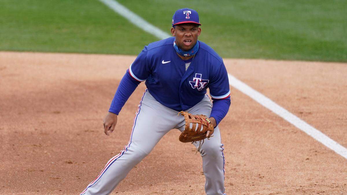 Texas Rangers first baseman Curtis Terry stands at first base during the first inning of a spring-training baseball game against the Milwaukee Brewers on Saturday, March 13, 2021, in Phoenix. 