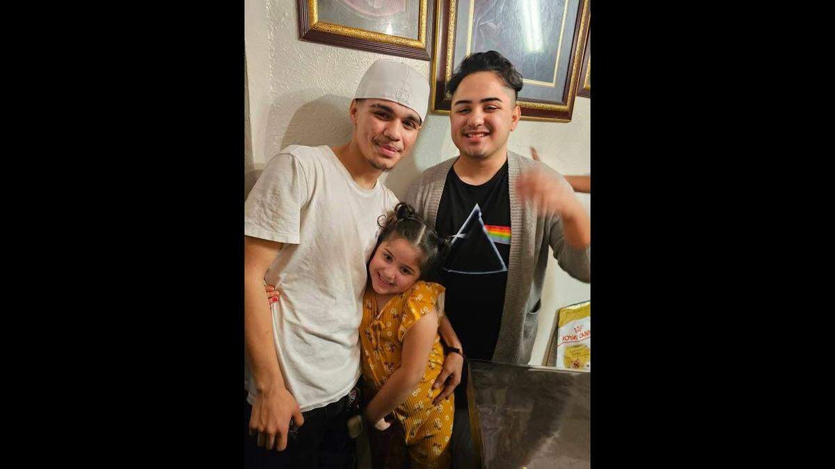 Emiliano Serna, left, poses for a picture with his little sister, middle, and older brother Oliver, right.