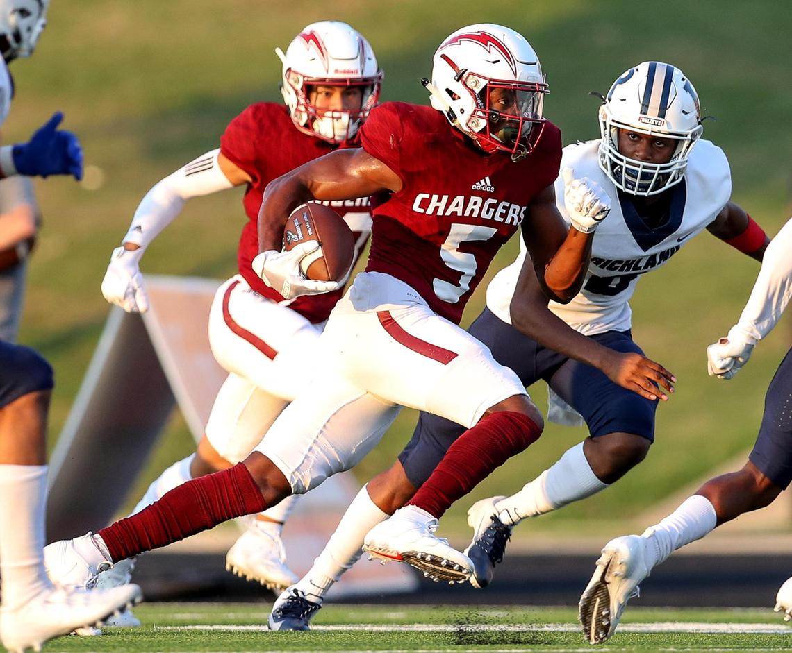 Keller Central wide receiver D.J. Graham (5) looks for running room after make a reception against Richland during the first half, Thursday night, September 5, 2019 played at Keller ISD Stadium in Keller, TX.