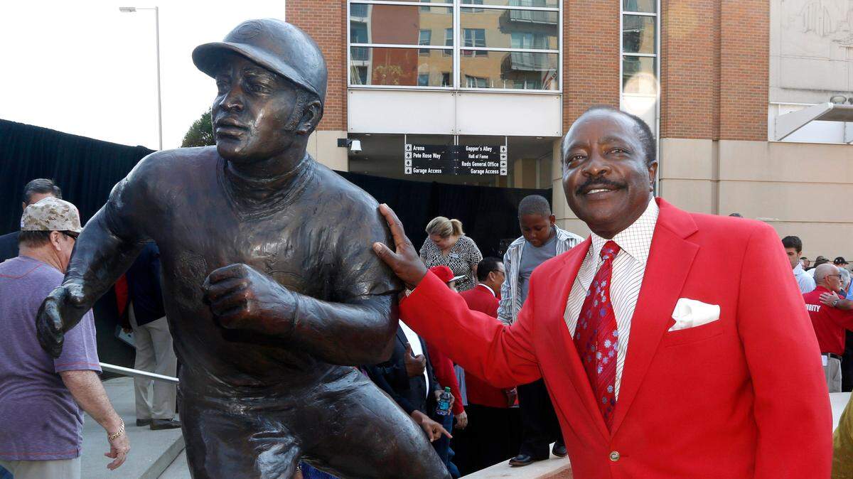 Hall of Fame second baseman Joe Morgan, posing with his statue outside the Cincinnati Reds’ ballpark, died at his home on Sunday.