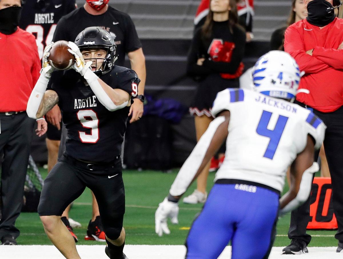 Argyle wide receiver Cash Walker (3) catches a pass behind the line of scrimmage and flicks it back to quarterback CJ Rogers (12) during a Conference 4A Division 1 State Championship football game at AT&T Stadium in Arlington, Texas, Friday, Dec. 18, 2020. Argyle defeated Lindale 49-21. (Special to the Star-Telegram Bob Booth)