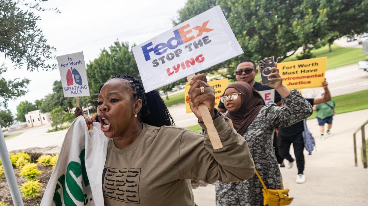 Teena James, a member of the Fort Worth Environmental Coalition of Communities, protests in support of the Echo Heights neighborhood outside of the City Hall building in downtown Fort Worth on Tuesday, June 10, 2025. FedEx applied for a conditional use permit to allow parking of semi-trucks and trailers in a part of the Echo Heights neighborhood, prompting a protest by the Fort Worth Environmental Coalition of Communities — a group of residents fighting environmental racism — urging the city to deny the permit.