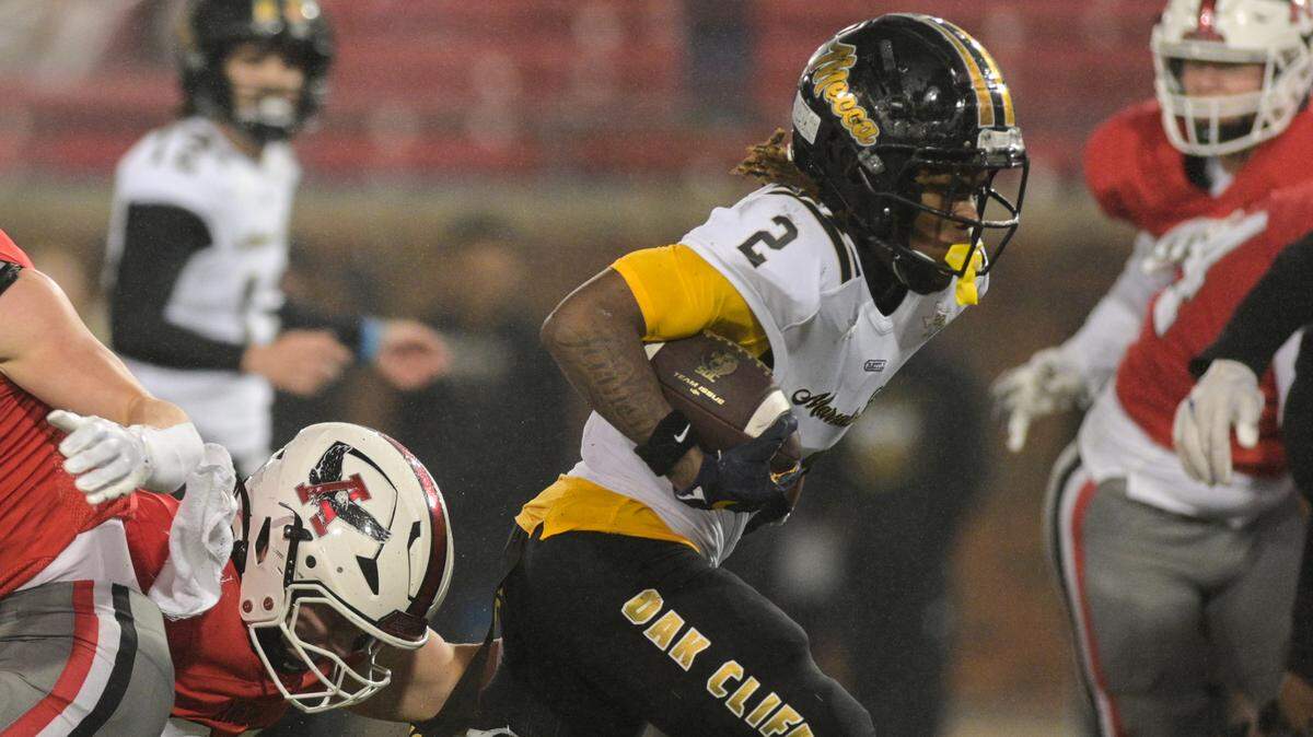 Dallas South Oak Cliff running back Mikail Trotter (2) powers through the Argyle defense during a Class 5A Division II state semifinal on Friday, Dec. 13, 2024 at Gerald J. Ford Stadium in University Park, Texas .