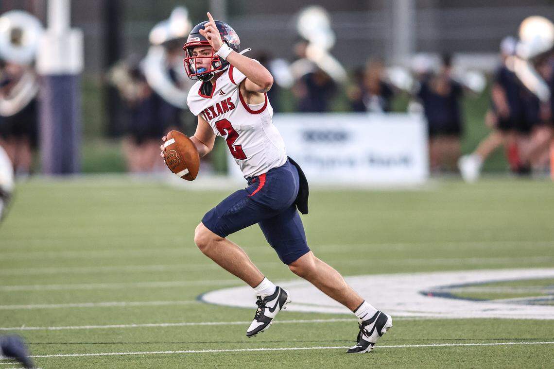 Northwest High School quarterback Mark Hartman (2)  gestures for a receiver to go deep In Friday’s District 4-6A game at Keller ISD Stadium. Tom Marvin / Special to the Star-Telegram