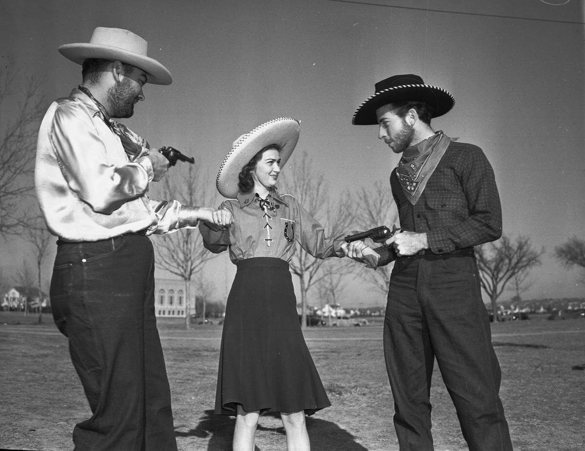 Jan. 30, 1940: Students at TCU assembled in their Western gear for the dress rehearsal of the first annual Ranch Festival. Miss Bobby Davidson of Grand Saline, Texas, is being forced to choose between two “bad guys” from the range, Bill Caudle of Mineola, left, and Bill Jennings of Taft.