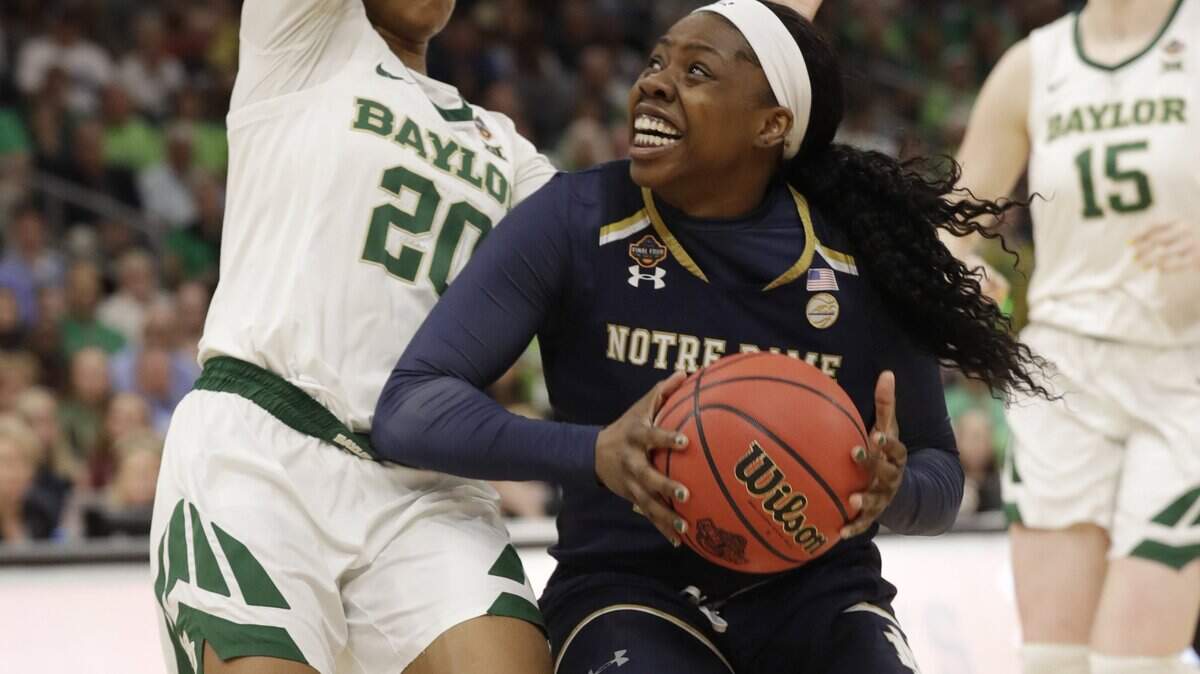 Notre Dame guard Arike Ogunbowale (24) drives to the basket as Baylor guard Juicy Landrum (20) defends during the first half of the Final Four championship game of the NCAA women’s college basketball tournament, Sunday, April 7, 2019, in Tampa, Fla.