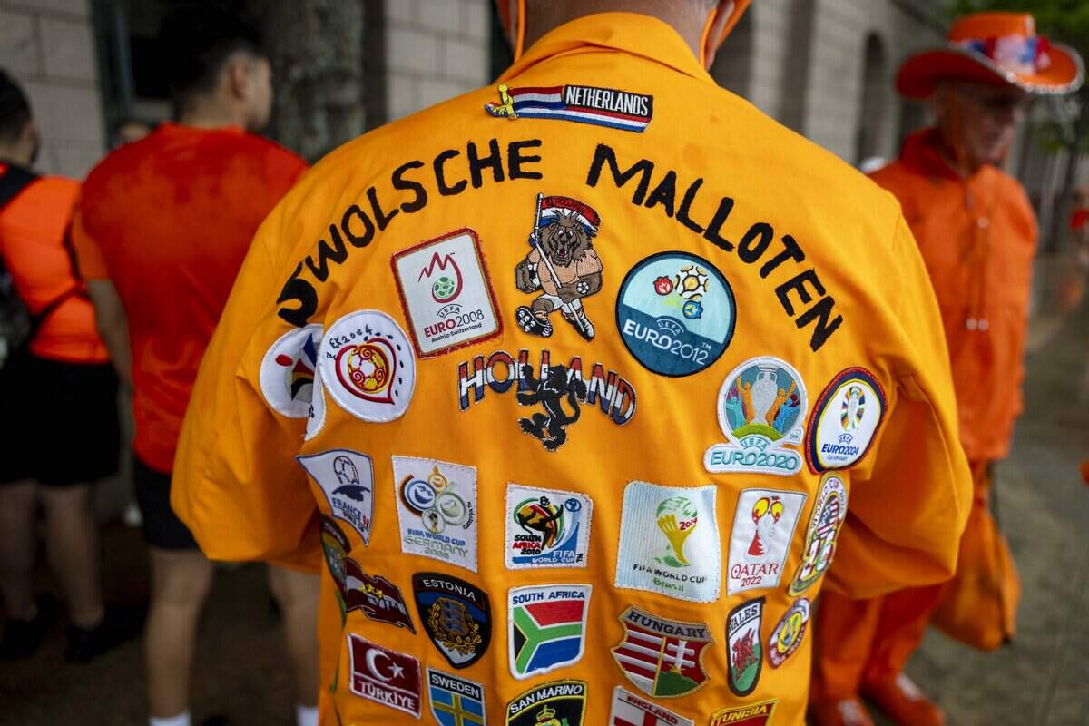 Netherlands soccer fan Hennie Van Heerde wears a homemade jacket to the FIFA World Cup match against Japan on Sunday, June 14, 2026 in Arlington, Texas.