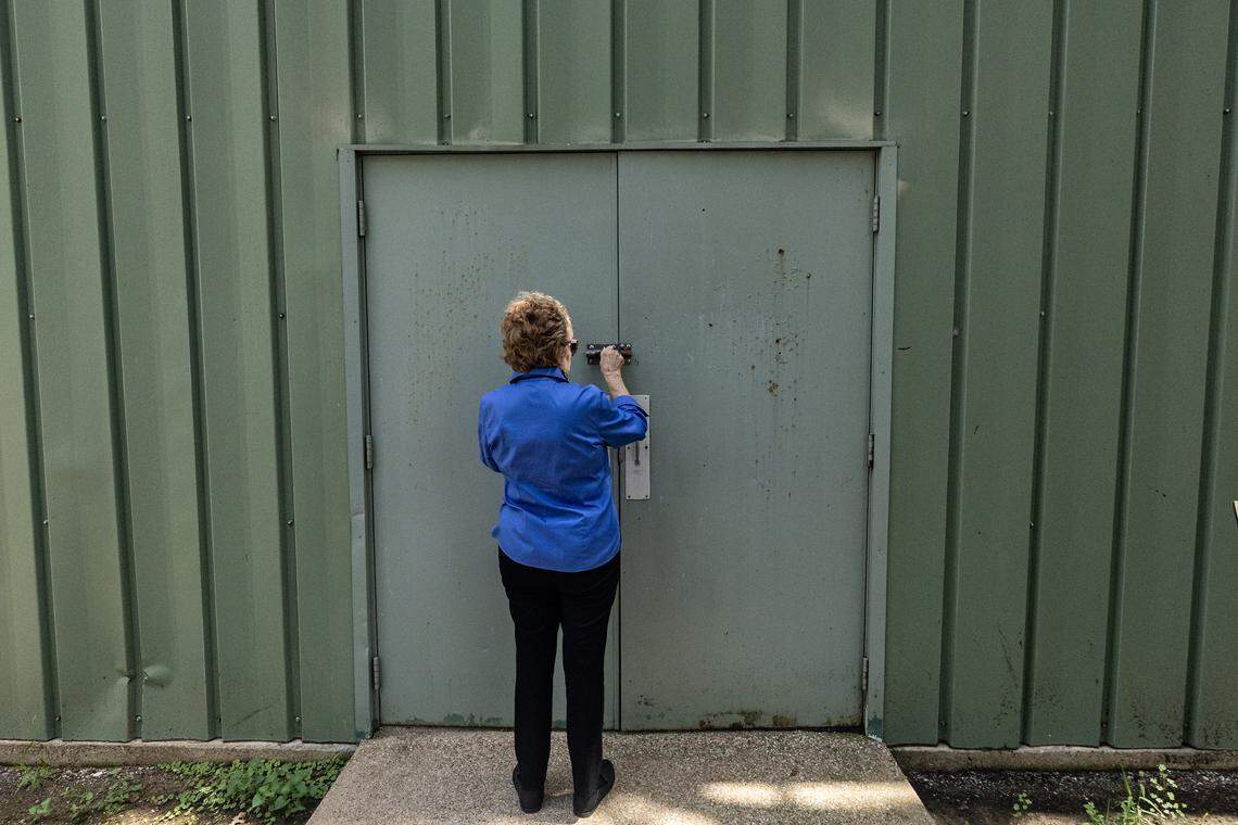 Curator and historian Vickie Bryant prepares to open the door to the pool where they store the gambling equipment and casino furniture of the former Top O' Hill Terrace casino and speakeasy on Wednesday, July 16, 2025.